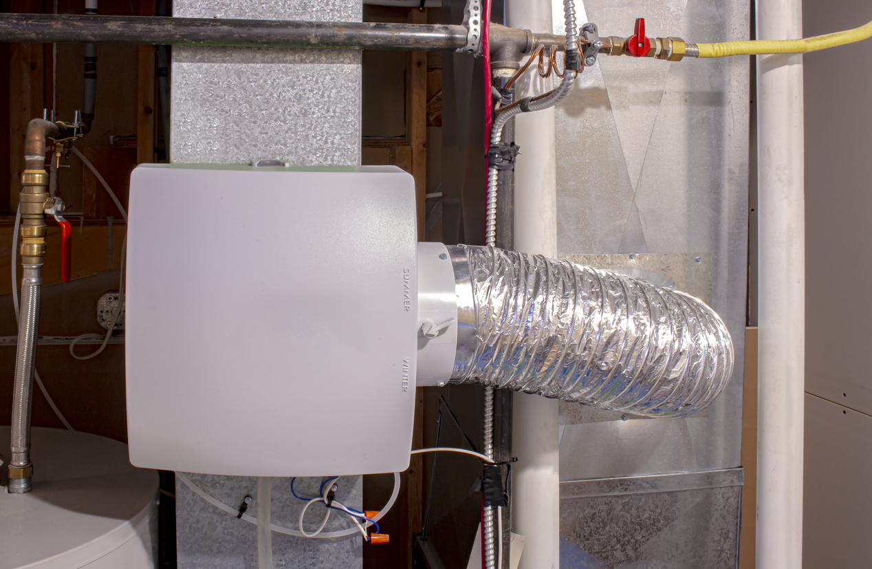 A whole-house humidifier installed on a furnace in an Omaha, NE home by Thermal Services.